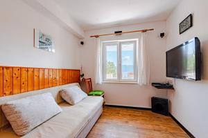 Televízia a/alebo spoločenská miestnosť v ubytovaní A1-apartment 50m from the beach with the sea view
