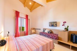 Postel nebo postele na pokoji v ubytování HibiscusUno Tropea Residence