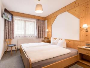 Łóżko lub łóżka w pokoju w obiekcie Apartment Kraxner