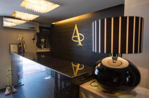 a lamp sitting on top of a table in a room at Aion Luxury Hotel in Nafplio