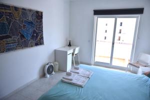 Ein Bett oder Betten in einem Zimmer der Unterkunft Casa Franki - Stylish and large beach apartment in Algarve