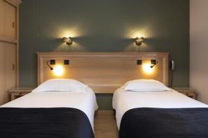 Кровать или кровати в номере Hôtel L'Escale - Piscine & SPA