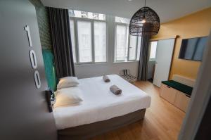Postel nebo postele na pokoji v ubytování Hotel Kanaï