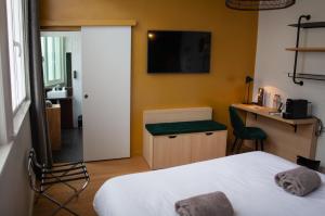 Postel nebo postele na pokoji v ubytování Hotel Kanaï