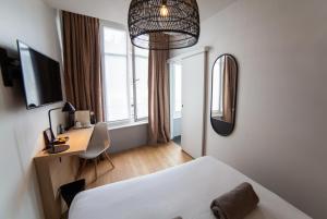 Postel nebo postele na pokoji v ubytování Hotel Kanaï