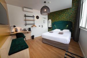 Postel nebo postele na pokoji v ubytování Hotel Kanaï