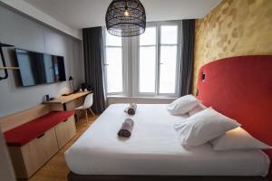 Postel nebo postele na pokoji v ubytování Hotel Kanaï