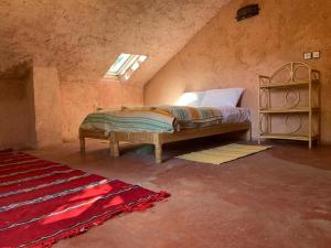 Giường trong phòng chung tại Gîte Camping Amazigh