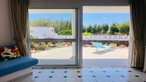 a view of a patio from a sliding glass door at Maya Powered by SolymarCalma in Costa Calma