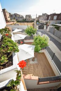 a view of a balcony with trees on a building at Vicino al mare in Santa Pola