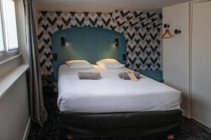 Postel nebo postele na pokoji v ubytování Hotel Kanaï