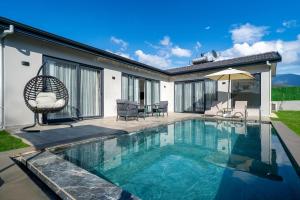 een zwembad voor een huis bij 2 Bedroom Private Villa with swimming pool in Kayakoy