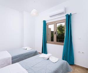 A bed or beds in a room at Halkidio House