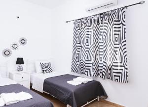 A bed or beds in a room at Halkidio House