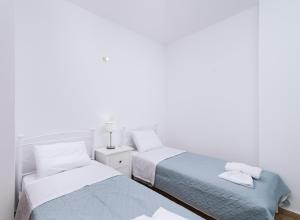 A bed or beds in a room at Halkidio House