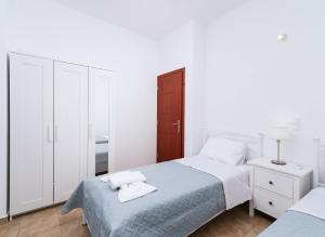 A bed or beds in a room at Halkidio House
