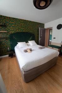 Postel nebo postele na pokoji v ubytování Hotel Kanaï