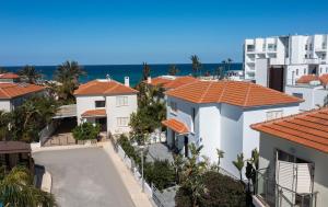 an aerial view of houses and the ocean at No.7 Athena Beach Villa, Pernera in Paralimni