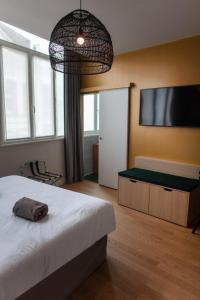 Postel nebo postele na pokoji v ubytování Hotel Kanaï