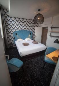Postel nebo postele na pokoji v ubytování Hotel Kanaï