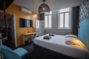 Postel nebo postele na pokoji v ubytování Hotel Kanaï