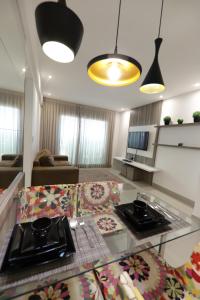 a large living room with a kitchen and a living room at Premium Flat Ponta Negra Natal in Natal