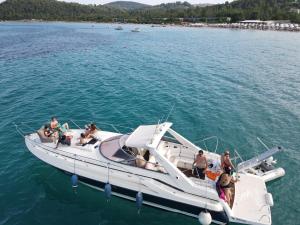 a group of people on a boat in the water at White Eagle Cruises Vourvourou Sithonia in Vourvourou