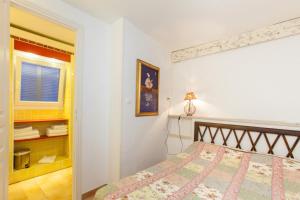 Postel nebo postele na pokoji v ubytování Hotel Villa Provencale