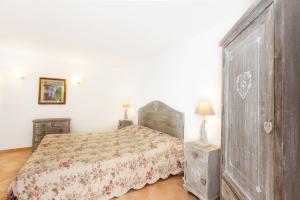 Postel nebo postele na pokoji v ubytování Hotel Villa Provencale