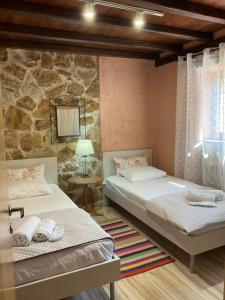 Ένα ή περισσότερα κρεβάτια σε δωμάτιο στο STONEHOUSE & CASA AL SOLE e AL MARE