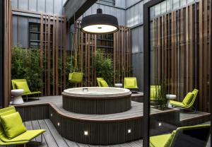 a hot tub in the middle of a building at Le Cinq Codet in Paris