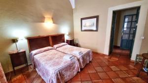 Postel nebo postele na pokoji v ubytování Casa Tinoco Casa Rural Categoria Superior