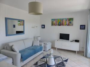 O zonă de relaxare la Appartement Pour 4 Personnes- Residence L accalmie