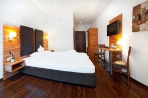 Ένα ή περισσότερα κρεβάτια σε δωμάτιο στο Hotel-Renner