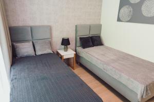 Posteľ alebo postele v izbe v ubytovaní Nice River - MAZURIA APARTAMENTY
