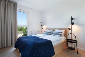 Llit o llits en una habitació de Elite Apartments Letnica Superior