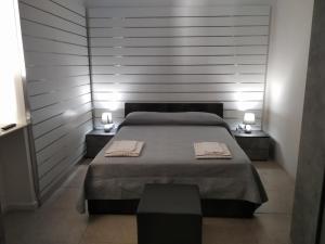 A bed or beds in a room at B&B Da Luca