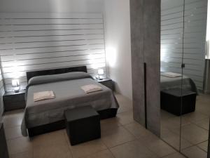 A bed or beds in a room at B&B Da Luca