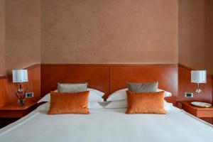 Postel nebo postele na pokoji v ubytování Perugia Park Hotel