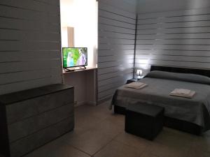A bed or beds in a room at B&B Da Luca