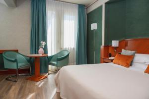 Postel nebo postele na pokoji v ubytování Perugia Park Hotel