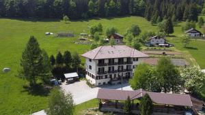 an aerial view of a large house in a field at Locanda La Ruscoletta in Telve