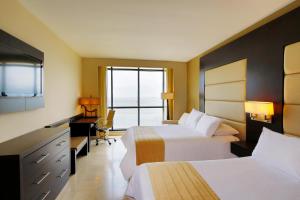 Cama ou camas em um quarto em Intercontinental Miramar Panama by IHG