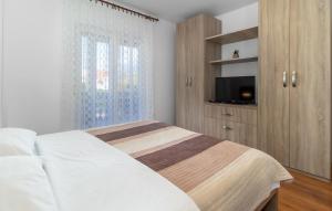 Posteľ alebo postele v izbe v ubytovaní APP 4+1 s dvije spavaće sobe
