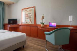 TV a/nebo společenská místnost v ubytování Perugia Park Hotel