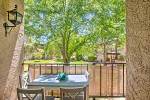 a table and chairs on a balcony with a tree at Bright Sedona Condo Resort-Style Amenities! in Sedona