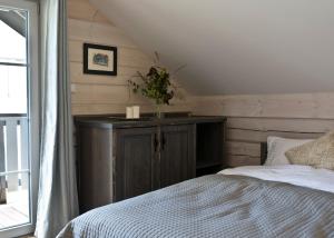 a bedroom with a bed and a table with candles at Góry Świateł in Krynica Zdrój