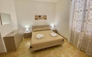 Posteľ alebo postele v izbe v ubytovaní Casa vacanza vista mare