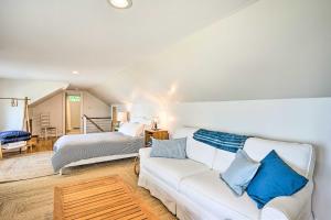 a living room with a couch and a bed at Bayside Deltaville Retreat with Beach and Bay Views! in Locklies