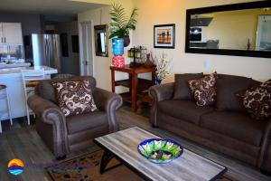 a living room with two couches and a table at Marina Pinacate A-510 in Puerto Peñasco